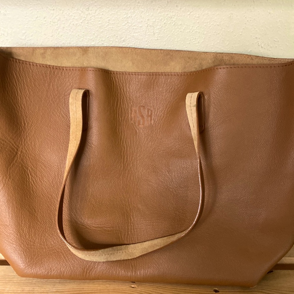 Italian leather tote. Size 19” wide 14.5” bottom x 12.5”h x 6.5”